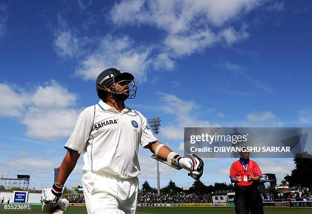 Indian cricketer Sachin Tendulkar walks back to the pavillion after loosing his wicket on his personal score of 160 runs during the third day of the...