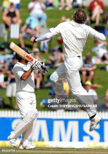 New Zealand cricketer Iain O'Brien celebrates the wicket of Indian batsman Sachin Tendulkar during the third day of the first Test match between...