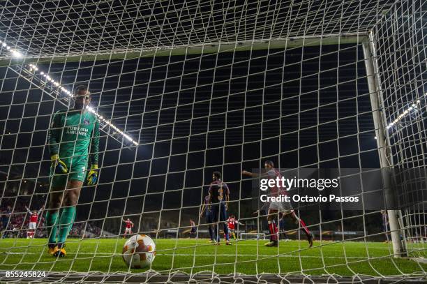 Fransergio of Sporting Braga scores the second goal with Volkan Babacan of Basaksehir F.K. During the UEFA Europa League group C match between...