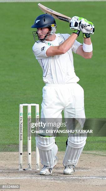 New Zealand cricketer Martin Guptill plays a shot during the third day of the first Test match between India and New Zealand at the Seddon Park...