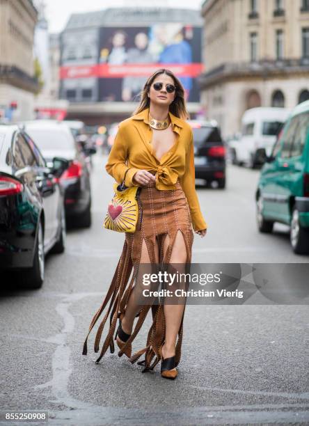 Thassia Naves wearing yellow blouse is seen outside Balmain during Paris Fashion Week Spring/Summer 2018 on September 28, 2017 in Paris, France.