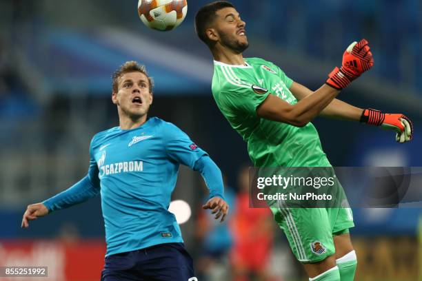 Aleksandr Kokorin of FC Zenit Saint Petersburg and Gerónimo Rulli of FC Real Sociedad vie for the ball during the UEFA Europa League Group L football...