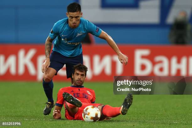 Matías Kranevitter of FC Zenit Saint Petersburg and Xabi Prieto of FC Real Sociedad vie for the ball during the UEFA Europa League Group L football...