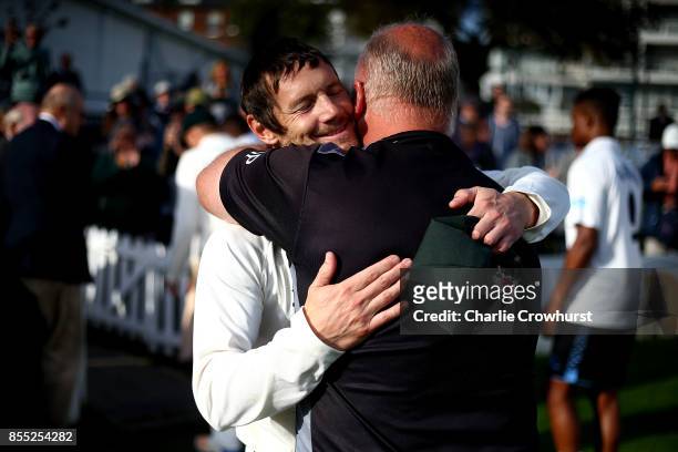 Nottingham's Chris Read celebrates with a member of coaching staff after captaining his team to promotion during day four of the Specsavers County...
