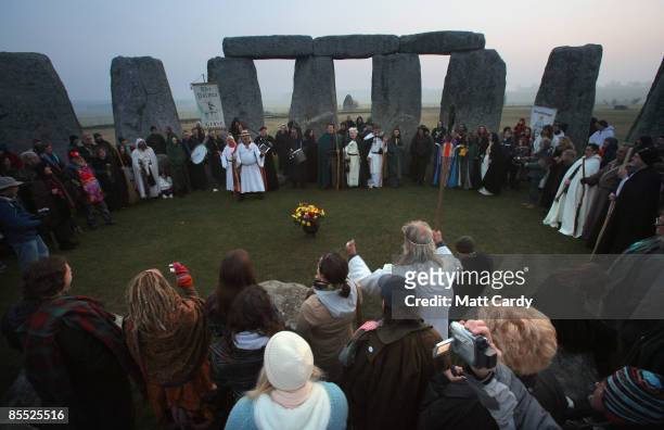 Druids wait for the sun to rise as they celebrate the Spring Equinox at Stonehenge on March 20 2009 near Amesbury, Wiltshire, England. Several...