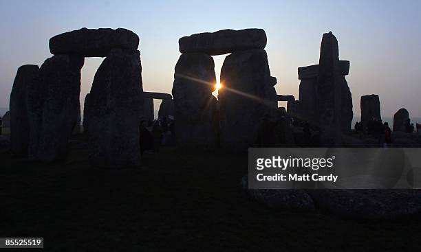 The sun rises over Stonehenge as druids celebrate the Spring Equinox at Stonehenge on March 20 2009 near Amesbury, Wiltshire, England. Several...