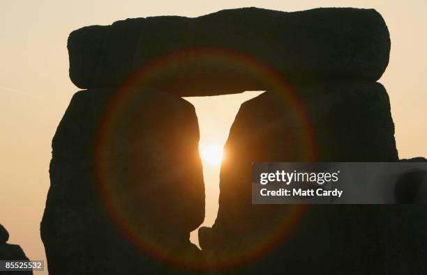 The sun rises over Stonehenge as druids celebrate the Spring Equinox at Stonehenge on March 20 2009 near Amesbury, Wiltshire, England. Several...