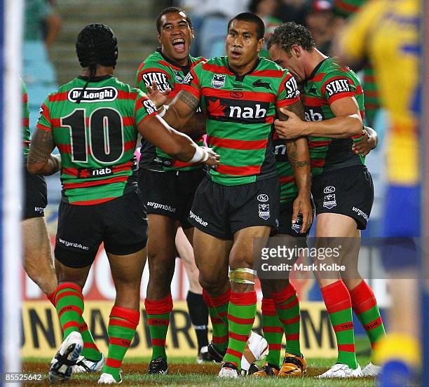 The Rabbitohs celebrate after a try in the first half during the round two NRL match between the South Sydney Rabbitohs and the Parramatta Eels at...