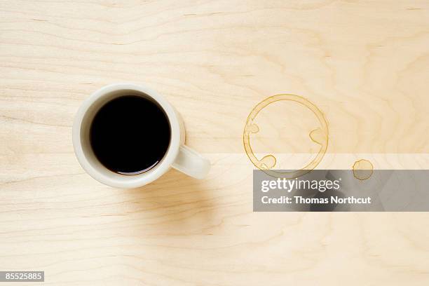 cup of coffee and coffee ring on table. - coffee cup from above stock pictures, royalty-free photos & images