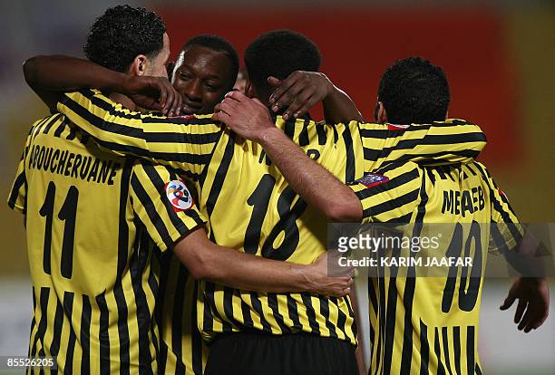 Saudi al-Ittihad players celebrate after scoring a goal against Qatar's Umm Salal during their AFC Champions League group C football match at the...