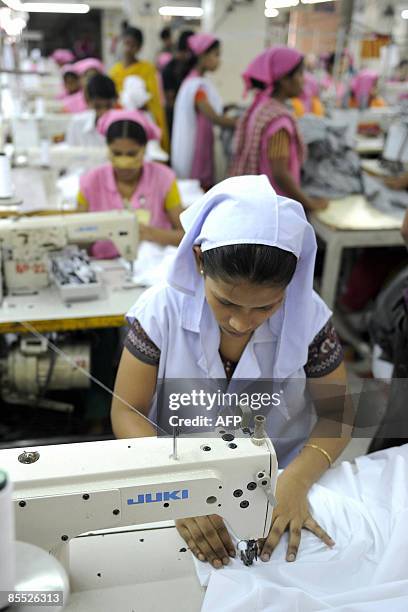 Bangladeshi Garment workers sew T-shirts at a factory in Dhaka, on March 18, 2009. Bangladesh is the world's second largest clothing exporter after...