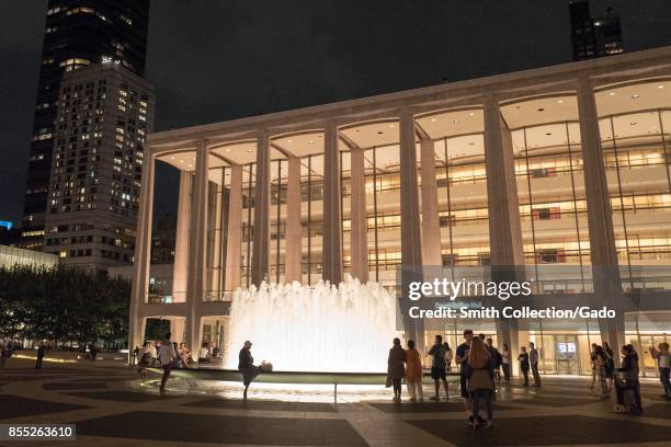 Tourists gather at the fountain at Lincoln Center in Manhattan, New York City, New York at night, September 14, 2017.