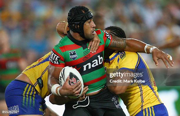 Roy Asotasi of the Rabbitohs looks to pass the ball out during the round two NRL match between the South Sydney Rabbitohs and the Parramatta Eels at...