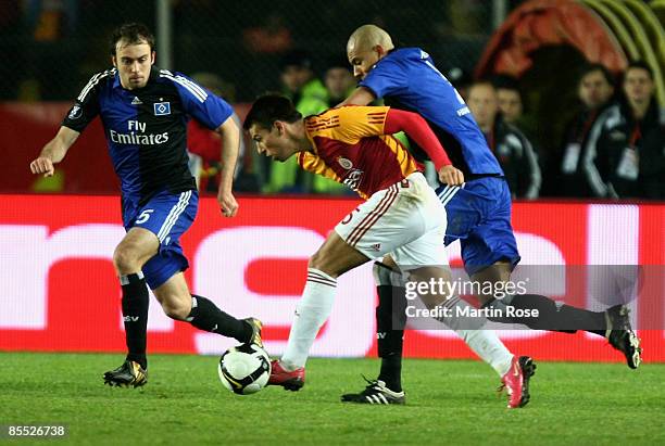 Milan Baros of Istanbul and Alex Silva of Hamburg battle for the ball during the UEFA Cup Round of 16 second leg match between Galatasaray Istanbul...