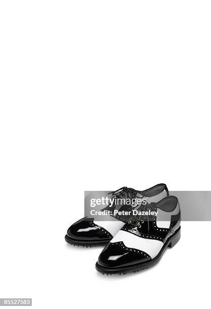 black and white brogue golf shoes on white - brogue stock-fotos und bilder