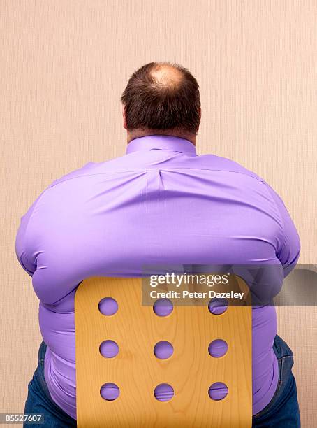 obese man on chair. - unhealthy living bildbanksfoton och bilder