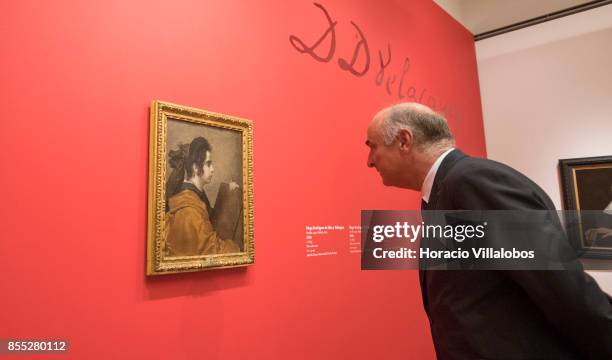 Spain Secretary of State for Culture Fernando Benzo Sainz looks at Diego Velazquez painting "A Sybil" during the opening day of its temporary...