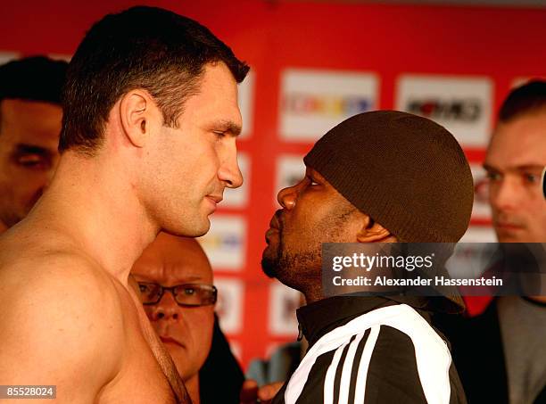 Juan Carlos Gomez of Cuba poses with Vitali Klitschko of Ukraine, after the weigh in at the Karstadt Sport shop on March 20, 2009 in Stuttgart,...