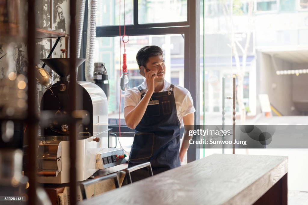 Small business owner working in the cafe