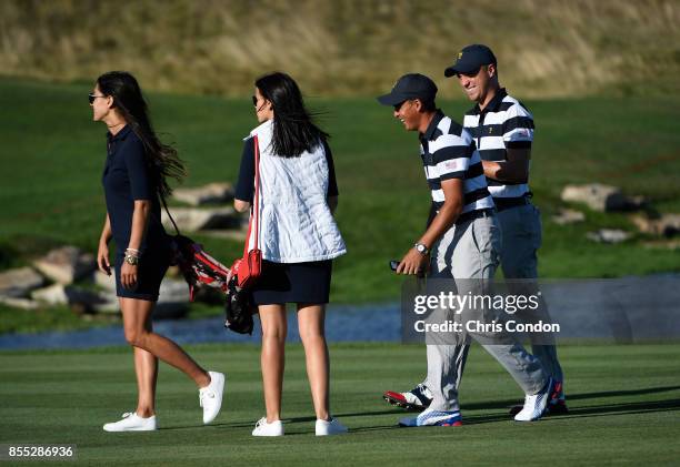 Allison Stokke and Jillian Wisniewski and Rickie Fowler of the U.S. Team and Justin Thomas of the U.S. Team during the first round of the Presidents...