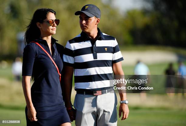 Allison Stokke and Rickie Fowler of the U.S. Team during the first round of the Presidents Cup at Liberty National Golf Club on September 28 in...