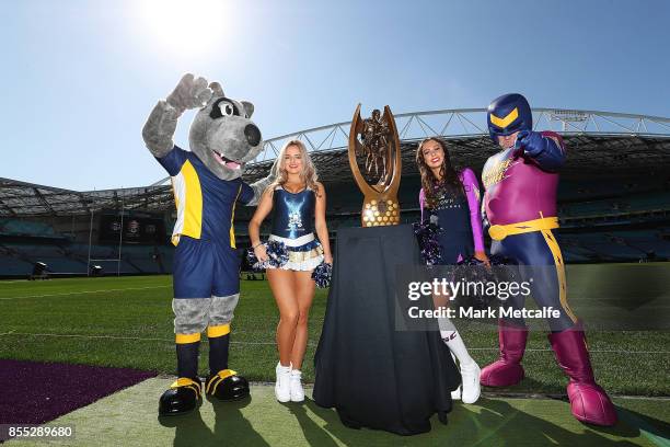 Cowboys and Storm cheerleaders and mascots pose with the Provan Summons trophy during a NRL Grand Final Media Opportunuty at ANZ Stadium on September...