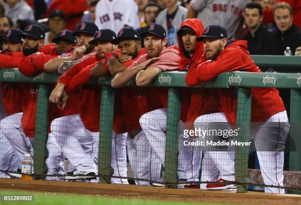 From right, Chris Sale, Rick Porcello, Doug Fister, Chris Young of the Boston Red Sox look on from the dugout during the first inning against the...