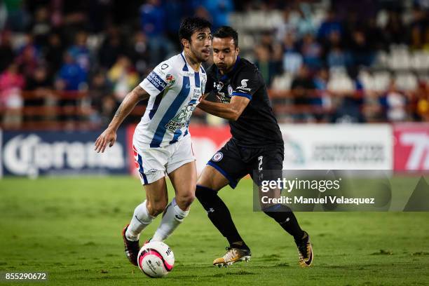 Edson Puch of Pachuca struggles for the ball with Omar Mendoza of Cruz Azul during the 11th round match between Pachuca and Cruz Azul as part of the...