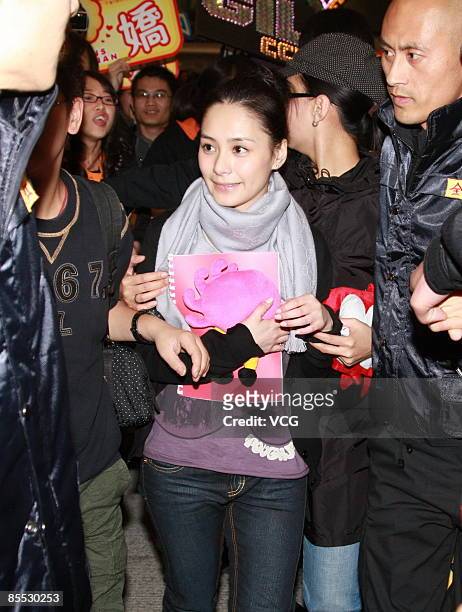 Hong Kong singer Gillian Chung, a member of the popular female music group "Twins", arrives at Beijing Capital International Airport on March 20,...