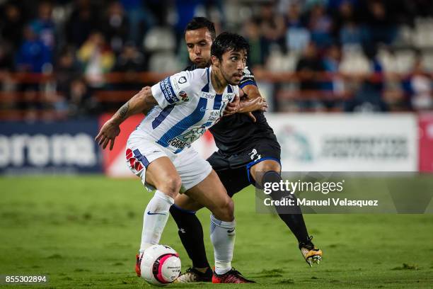 Edson Puch of Pachuca struggles for the ball against Omar Mendoza of Cruz Azul during the 11th round match between Pachuca and Cruz Azul as part of...