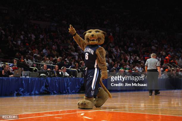 Villanova Wildcats mascot Will D. Cat cheers during the semifinal round of the Big East Tournament against the Louisville Cardinals at Madison Square...