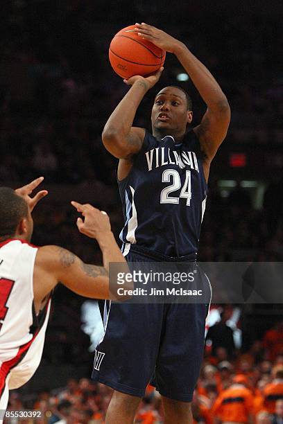 Corey Stokes of the Villanova Wildcats shoots against the Louisville Cardinals during the semifinal round of the Big East Tournament at Madison...