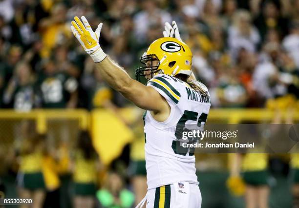 Clay Matthews of the Green Bay Packers celebrates after recording a sack in the first quarter against the Chicago Bears at Lambeau Field on September...