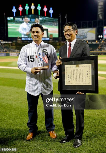 Former Chicago White Sox player Tadahito Iguchi is honored by Naoki Ito, consul general of Japan in Chicago at Guaranteed Rate Field on September 28,...