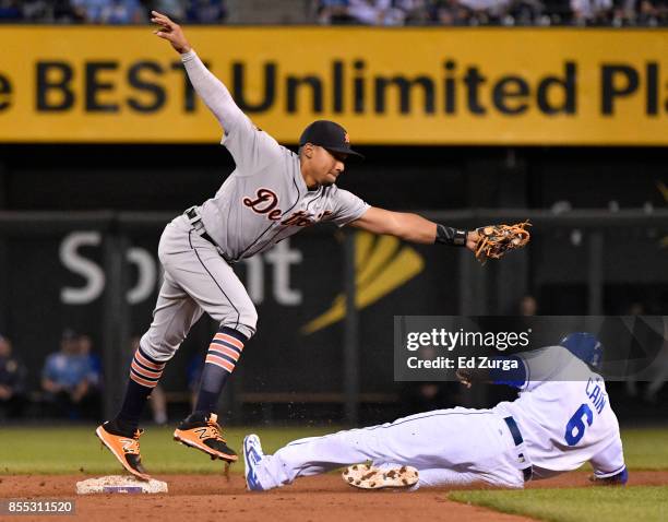 Dixon Machado of the Detroit Tigers steps on second as he gets the force out on Lorenzo Cain of the Kansas City Royals in the fourth inning at...