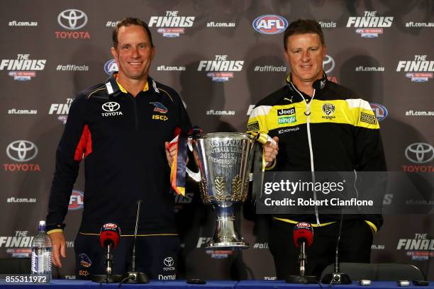 Crows coach Don Pyke and Tigers coach Damien Hardwick pose with the AFL Premiership Cup during the 2017 AFL Grand Final press conference on September...