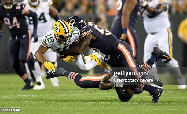 Randall Cobb of the Green Bay Packers is tackled by Danny Trevathan of the Chicago Bears in the first quarter at Lambeau Field on September 28, 2017...