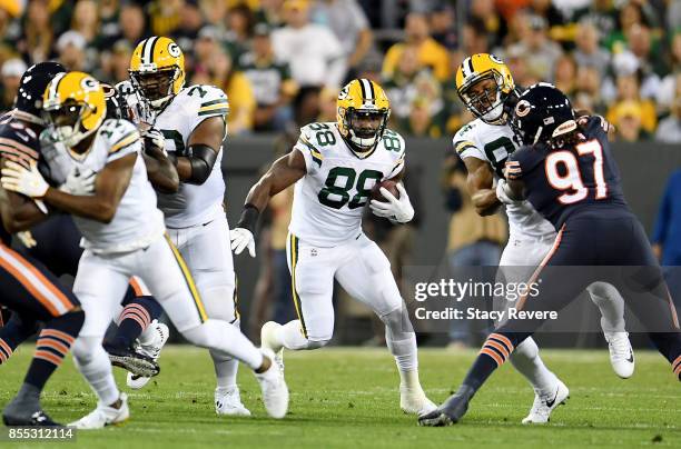 Ty Montgomery of the Green Bay Packers runs with the ball in the first quarter against the Chicago Bears at Lambeau Field on September 28, 2017 in...