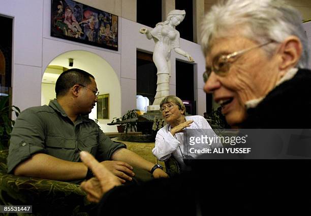 British tourist Bridget Jones sits with US nationals David Chung and Joel Rawlins at the lobby of their hotel in Baghdad on March 20, 2009. When...