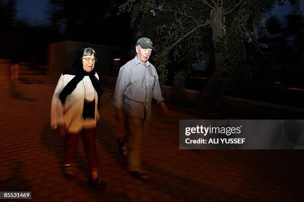 British nationals Bridget Jones and Gordon Moore take an evening walk in Baghdad's Abu Nawas Street on March 20, 2009 on March 20, 2009. When Jones...