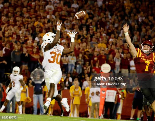 Running back Toneil Carter of the Texas Longhorns pulls in a touchdown pass over linebacker Joel Lanning of the Iowa State Cyclones in the first half...