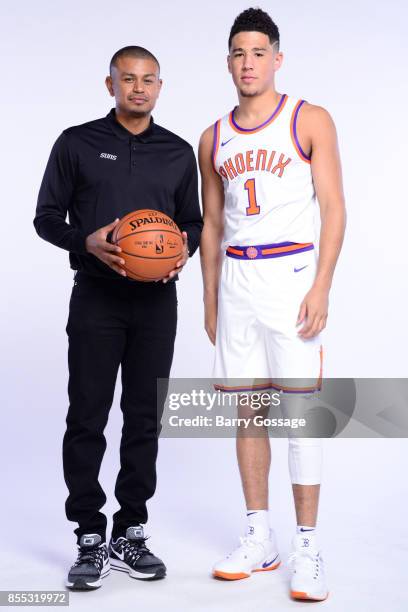 Head Coach Earl Watson and Devin Booker of the Phoenix Suns pose for a portrait at the Talking Stick Resort Arena in Phoenix, Arizona. NOTE TO USER:...