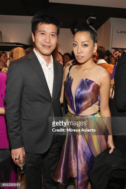 Store owner, Thomas Tchen and Julie Judd attend the Lancaster Collection presentation during Paris Fashion Week Womenswear Spring/Summer 2018 on...