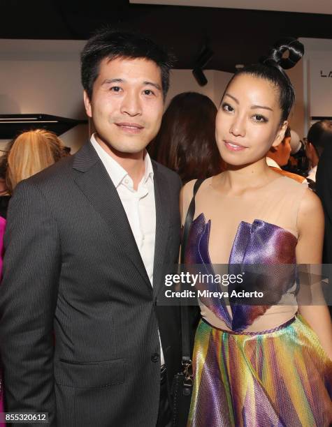 Store owner, Thomas Tchen and Julie Judd attend the Lancaster Collection presentation during Paris Fashion Week Womenswear Spring/Summer 2018 on...