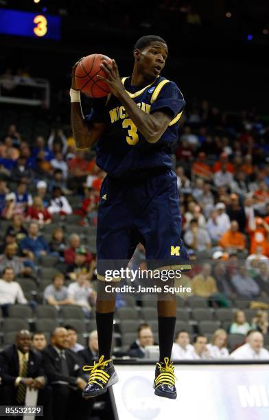 Manny Harris of the Michigan Wolverines rebounds the ball during their first round game against the Clemson Tigers in the NCAA Division I Men's...