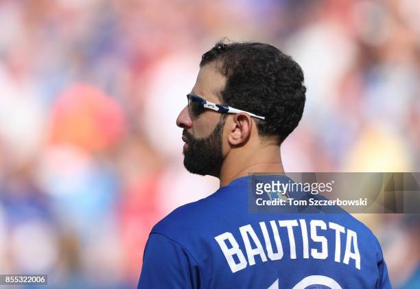 Jose Bautista of the Toronto Blue Jays stands during the playing of the national anthems before the start of MLB game action against the New York...