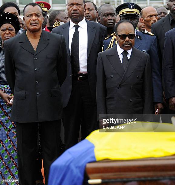 Gabon President Omar Bongo stands at his wife, Edith Lucie Bongo's, coffin on March 19, 2009 at the Presidential Palace in Libreville on March 19,...