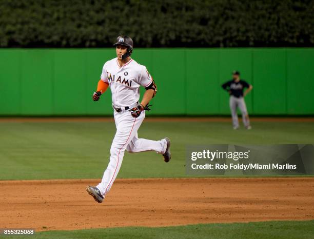 Giancarlo Stanton of the Miami Marlins runs the bases after hitting his fifty-ninth home run of the season during the eighth inning of the game...