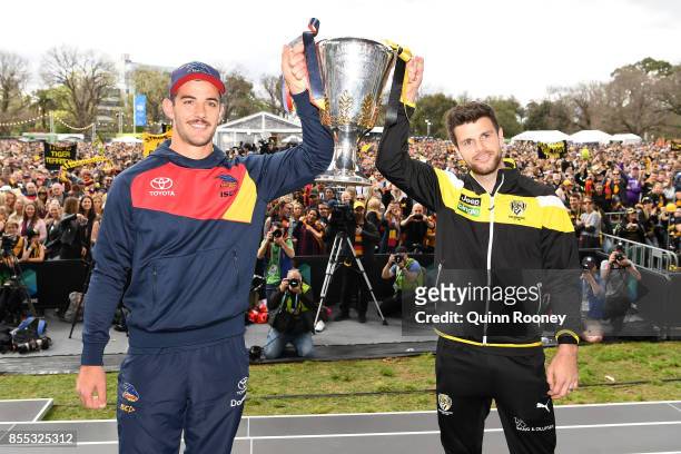 Crows captain Taylor Walker and Tigers captain Trent Cotchin pose with the AFL Premiership trophy during the 2017 AFL Grand Final Parade ahead of the...
