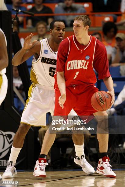 Forward Leo Lyons of the Missouri Tigers defends against center Jeff Foote of the Cornell Big Red in the first round of the NCAA Division I Men's...